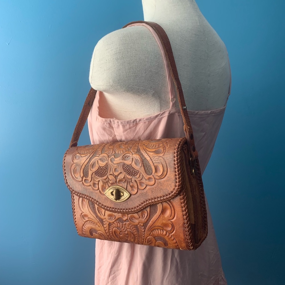 Vintage hand tooled leather purse with brass clasp